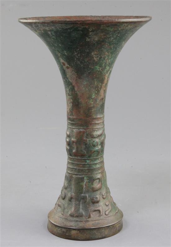 A Chinese archaic bronze ritual wine vessel, Gu, late Shang dynasty, 12th-11th century B.C., probably Anyang, 21.5cm high